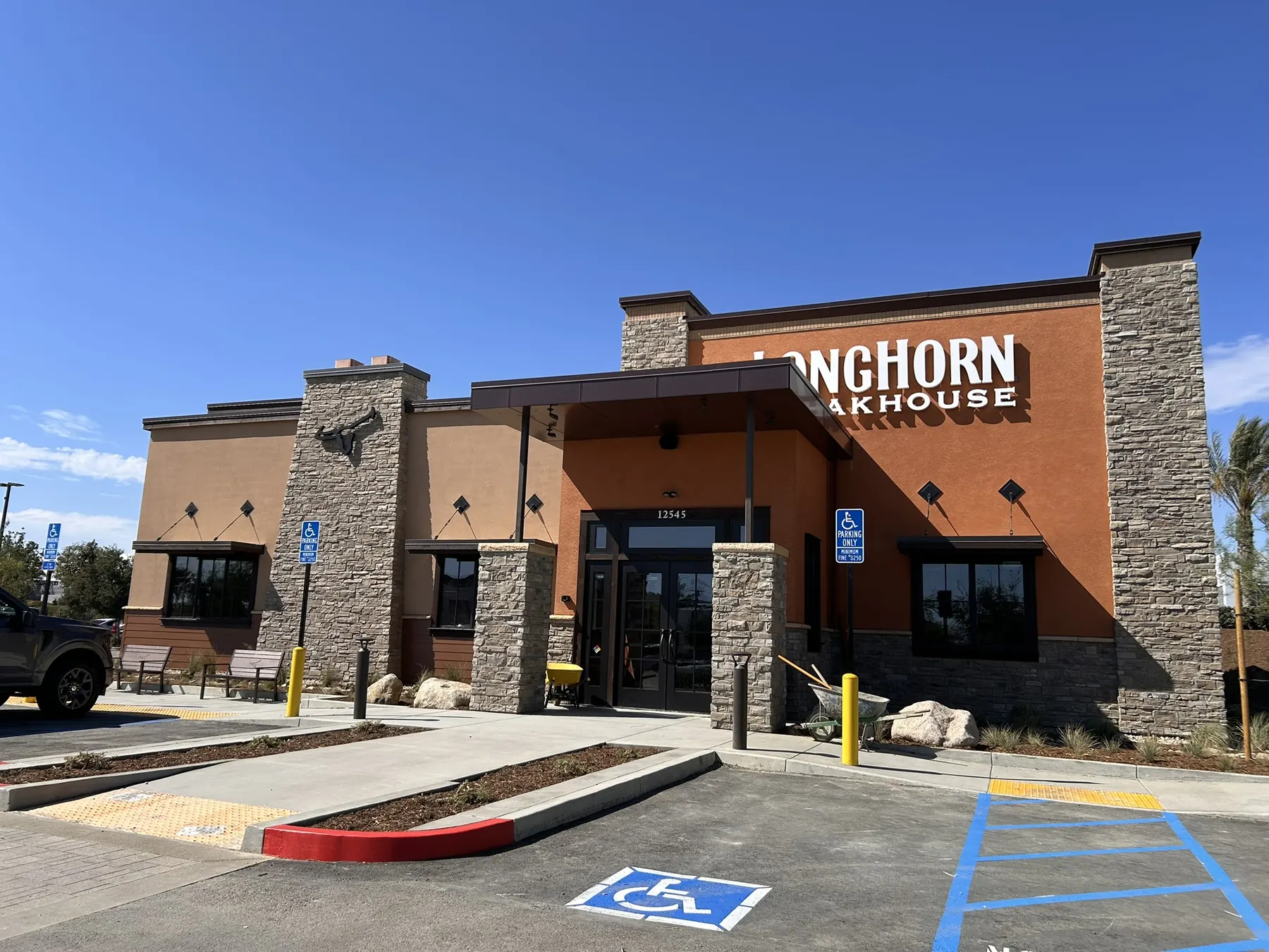 LongHorn Steakhouse restaurant exterior with stone veneer entry piers and stone wainscot