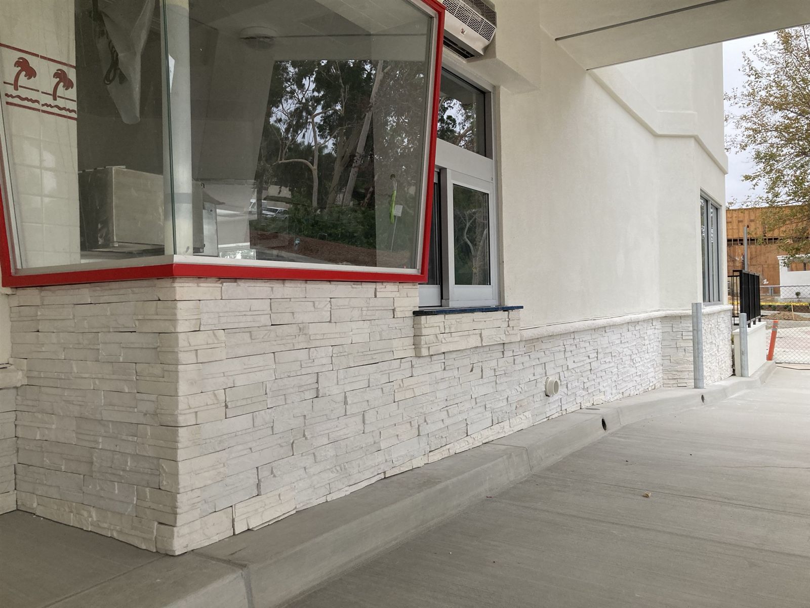 White stone exterior masonry project by CMF Masonry