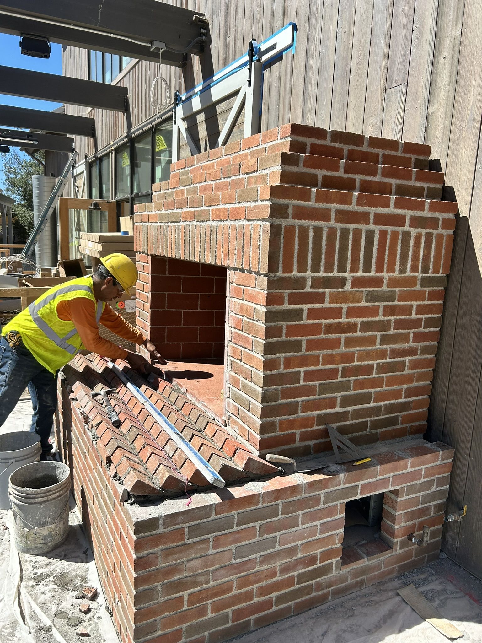 Outdoor fireplace by CMF Masonry