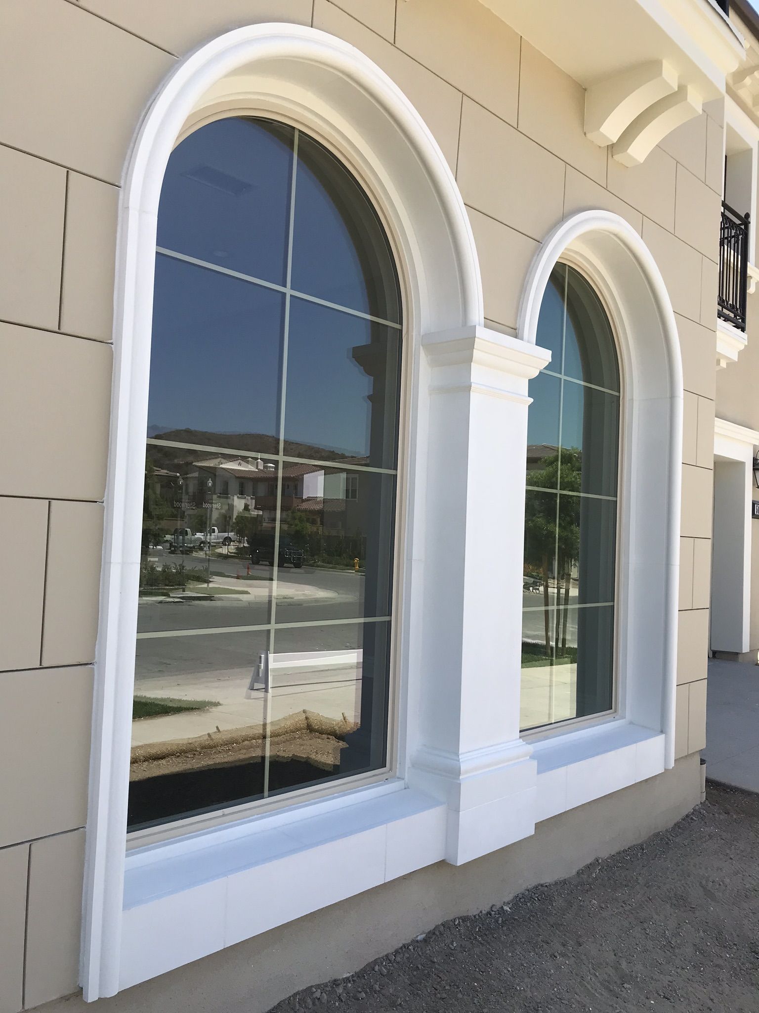 Arched window surrounds precast by CMF Masonry