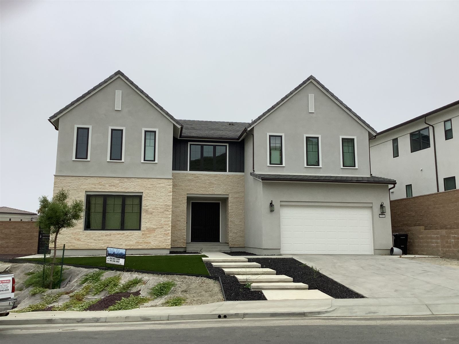 White contemporary residence by CMF Masonry