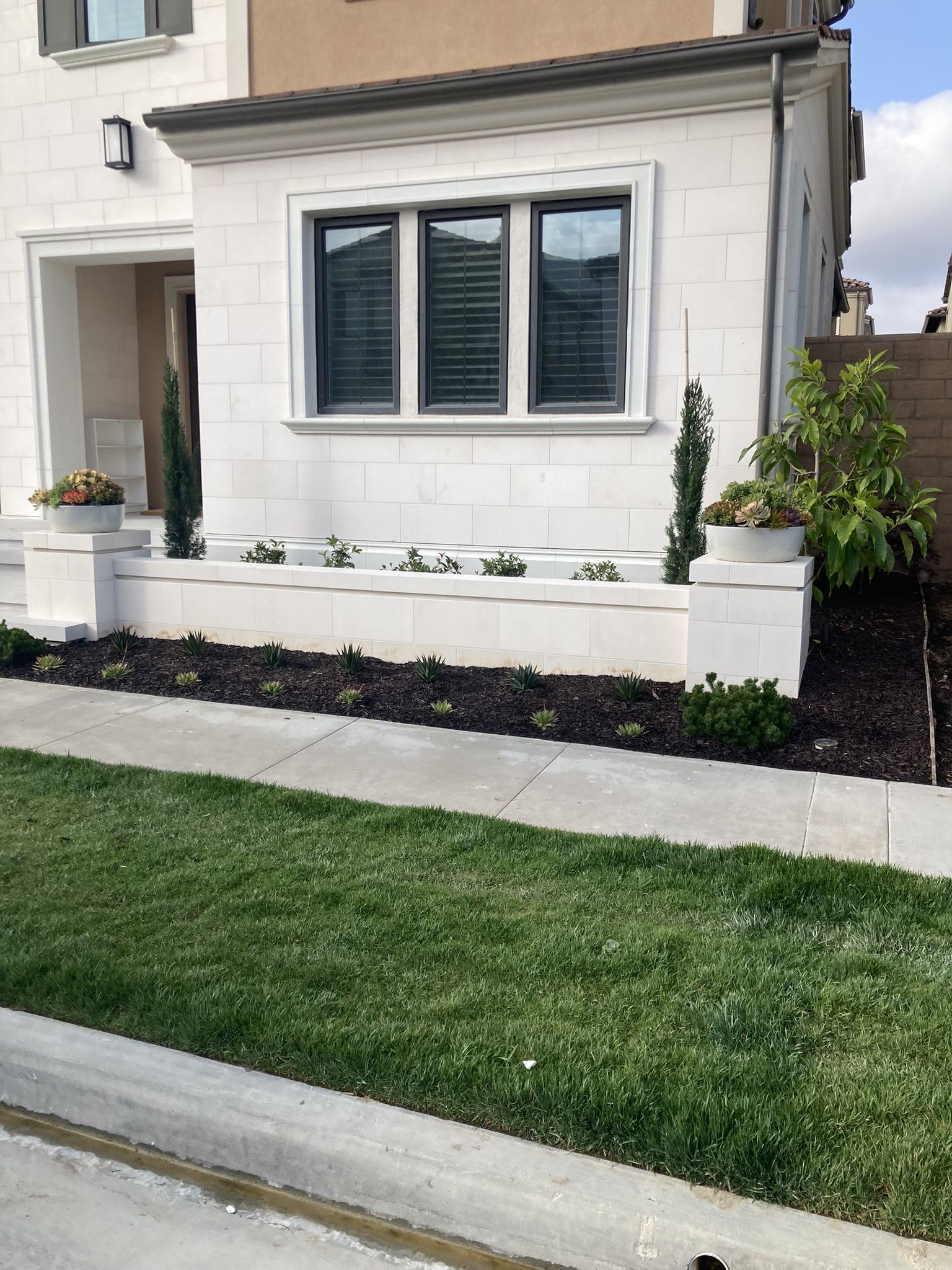 White stucco residence with front lawn